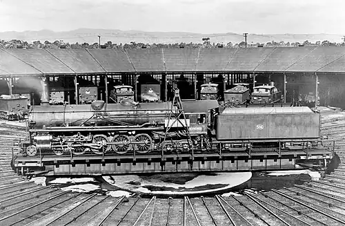 A non-streamlined SAR 500 class locomotive, number 506, on the 85 foot turntable in the roundhouse at Mile End locomotive depot, Adelaide, South Australia