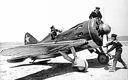 Aircraft maintenance technicians performing pre-flight preparation of a&nbsp;Soviet Naval Air Force Polikarpov I-16 fighter, a&nbsp;pre–World War&nbsp;II photo