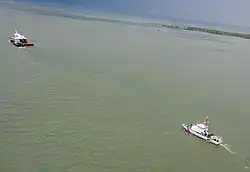Aerial view of Space Shuttle Explorer exiting Gulf of Mexico