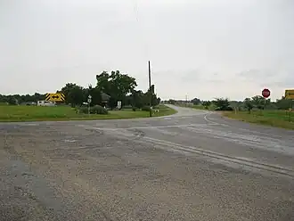 FM 1161 curves sharply to the northeast at FM 640 in Spanish Camp.
