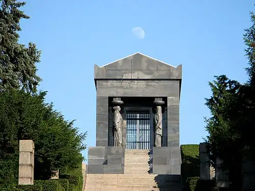 Art Deco caryatids of the Monument to the Unknown Hero, atop Mount Avala, south-east of Belgrade, Serbia, wirhcaryatids representing all the peoples of the Kingdom of Yugoslavia, by Ivan Meštrović, 1934–1938[35]
