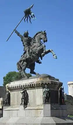 Statue of William the Conqueror in Falaise (surrounded by six other Dukes of Normandy)