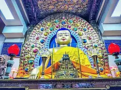 Seated Buddha statue inside a temple hall