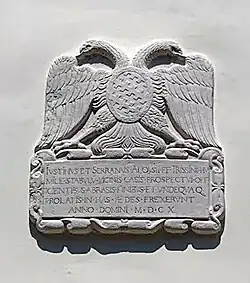 Stone plaque from 1610 bearing the Trissino family coat of arms at the entrance to Villa Trissino in Sandrigo (VI).