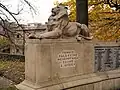 Left lion pedestal and inscription