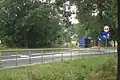 Road with a bus stop shelter