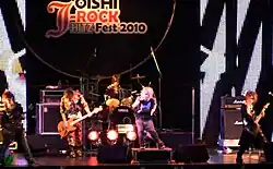 Sug performing in Bangkok in 2010