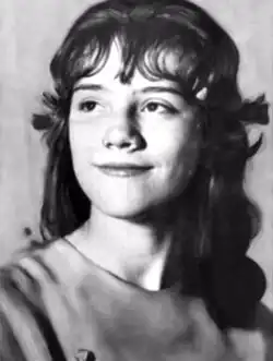 Black-and-white head shot of Likens smiling