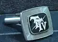 First version of the TTV logo on a cufflink for senior executives