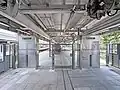 Glass barriers blocking off section of platform no longer in use