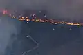 A helicopter circles the fire on July 22.