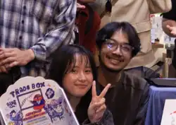 Tisha and Osvaldorio in a middle of a group photo with fans at a fan meetup held at Pasar Santa, South Jakarta, 19th December 2025.