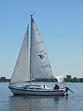 Tanzer 22 with a homemade bimini top fitted.