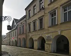 Initial section of Gliwicka Street with arcaded houses