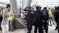 Legislator Ted Hui mediates, urging police not to clear the mall.