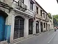Shophouses along Bamrung Mueang road, Samran Rat intersection is ahead