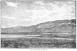 Black and white sketch. From north to south are seen a river bank, a town and mountains