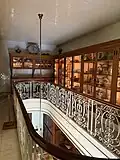 Dinnerware storage mezzanine and butler's pantry below, 2025