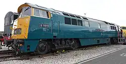 Western Champion in rail blue livery with full yellow ends and marker lights