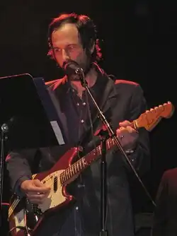 Berman reads from a music stand