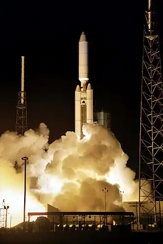 A Titan IV-B rocket lifts off after ignition of 2 SRMU boosters