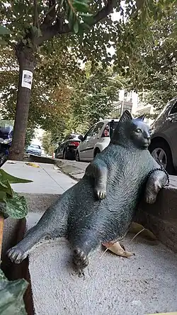 A statue of a reclining cat