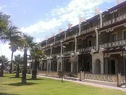 Marine Terrace, Grange Beach (1884). A key example of the Adelaide-style, with three storeys of setback filigree verandahs.[52]