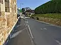 The main road through the village. The village has a large number of calming chicanes.