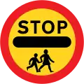 Stop, children crossing ahead (Handheld sign)[n]