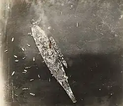Photo taken from an airplane flying over USS Missouri. USS&nbsp;Buchanan is alongside.