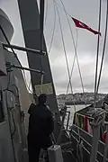 A courtesy Turkish flag is raised aboard the destroyer USS&nbsp;Truxtun as the ship transits the Bosphorus Strait