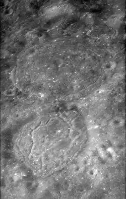 Oblique Apollo 17 panoramic camera image facing north with van den Bos below center and Tamm above center