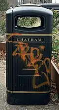 Graffiti on a public bin at The Paddock in Chatham, Kent