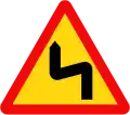 W.202a: Double bend first to left