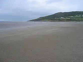 Red Wharf Bay with fish weir in the distance