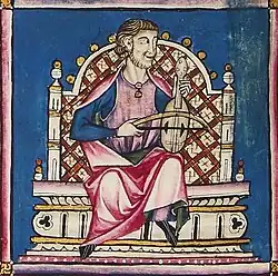 Vielle or vihela de arco in the Cantigas de Santa Maria, Codex of musicians, circa 1280 A.D. Image demonstrates playing upright on the musician's knee.