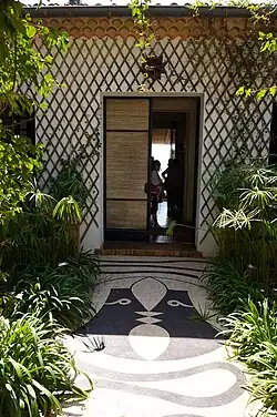 A front door with decorative tile and mosaic