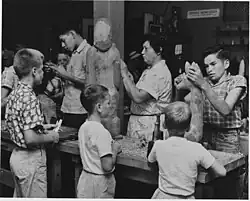 Amanda Crowe demonstrating woodcarving at the Craftsmen's Fair in Cherokee, North Carolina