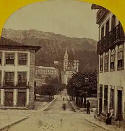 Photograph from circa  1869 showing the Santos Passos Church in the background where it can be seen one of its bell towers still under construction.
