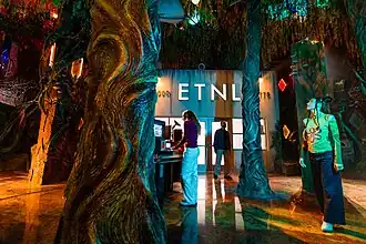 Interior view of Meow Wolf Houston's Radio Tave with colorful installations and lighting