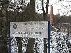 Former welcome sign