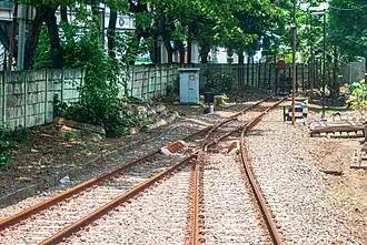 A railroad switch at the end of the Merak Station emplacement which is used for locomotive shunting