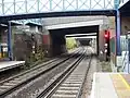 The West London Line passing under Lillie Bridge towards Kensington (Olympia) station