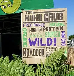 A sign that advertises huhu grubs as food