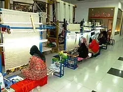 Women weaving silk, Kashgar