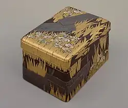Inlaid maki-e raden writing Box with "Eight Bridges" ( yatsuhashi ) design, by Ogata Kōrin, National Treasure, Edo period, 18th century. The flowers are abalone shell inlays. Tokyo National Museum[10]