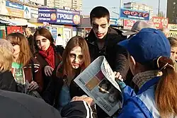 Yulia Mykytenko takes part in a theatralized "zombie-demonstration" against the "Vesti newspaper&nbsp;[wikidata]", which was thought by activists to be engaged in anti-Ukrainian propaganda, April 2015 (second from the left, in a red scarf).