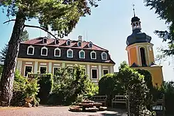 Building with many windows, detached tower