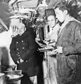 Polish soldiers eating dinner in ORP Ryś.