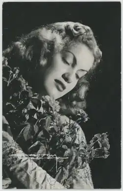 A black and white photograph of a woman